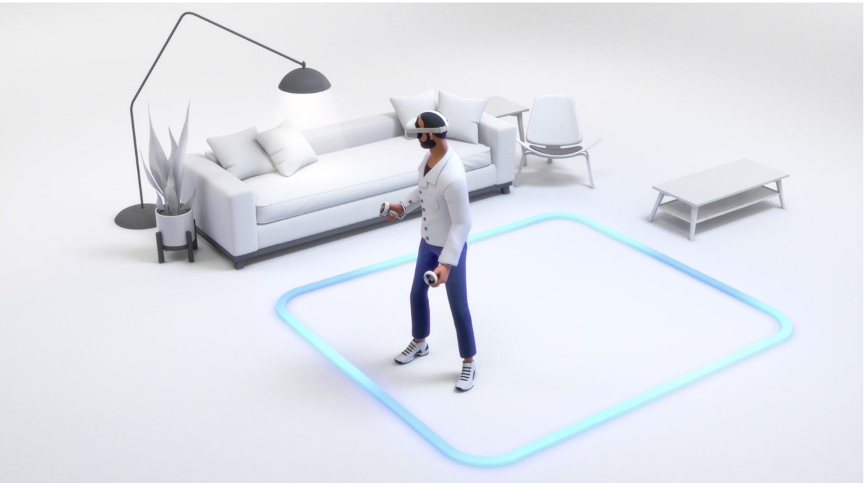Person in a headset standing inside a clear play area